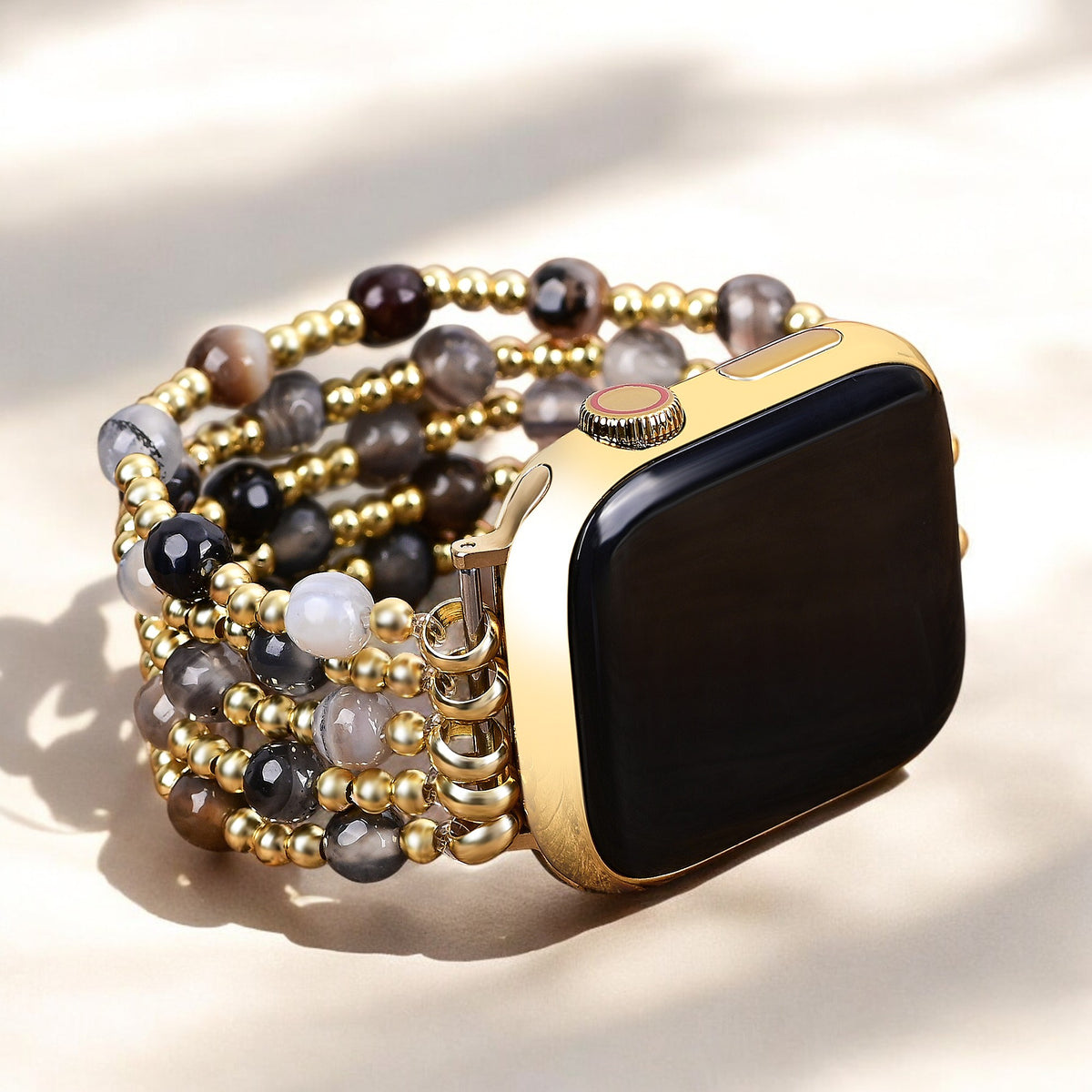 Correa elástica Apple Watch en color dorado y perlado