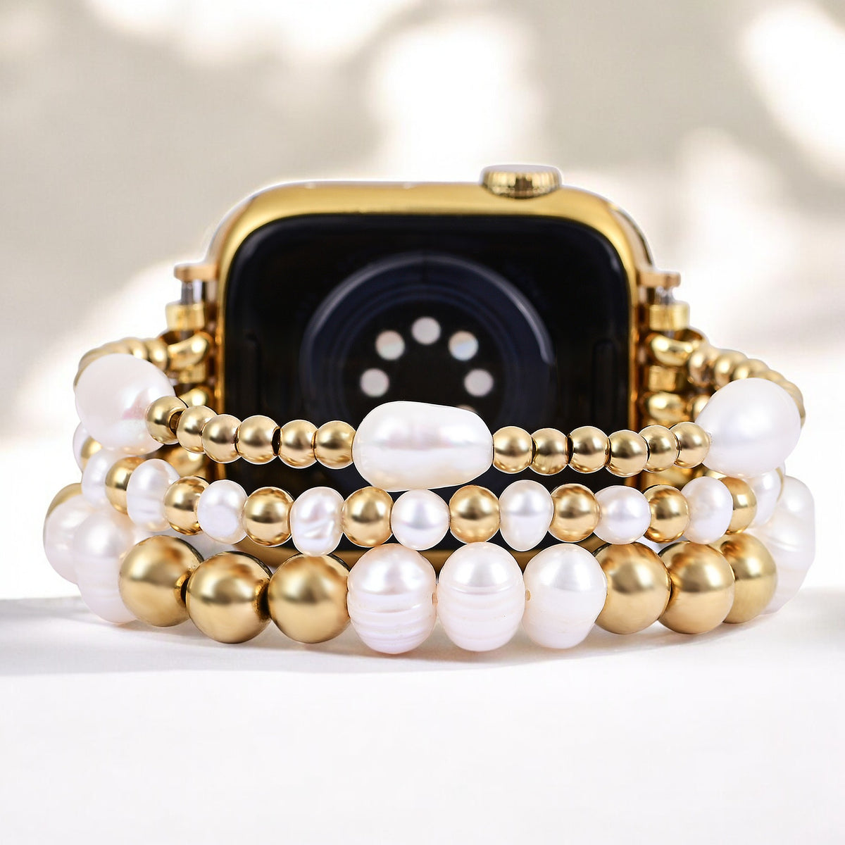 Correa elástica de perlas de agua dulce doradas para Apple Watch