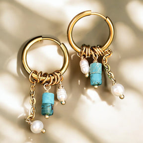 Pendientes de aro con gota de flor en cielo dorado